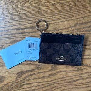 Coach “Mini Skinny ID case” wallet
